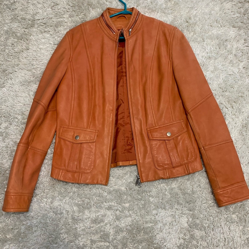 Danier orange leather coat.